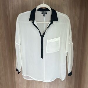 White sheer blouse with black collar and caffs